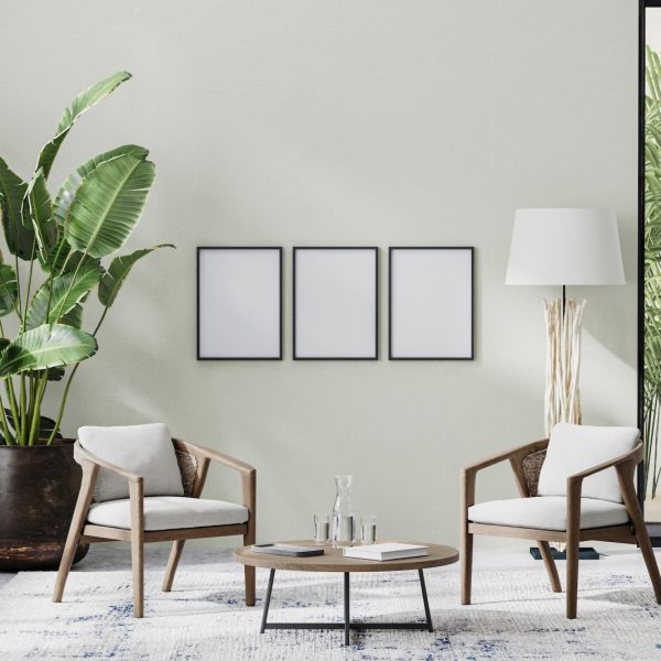 poster-frames-in-room-interior-with-light-neutral-wall-with-sunlight-and-wooden-furniture.jpg